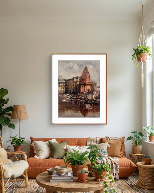 Living room with a framed art of a varanasi ghat and temple painting on the wall